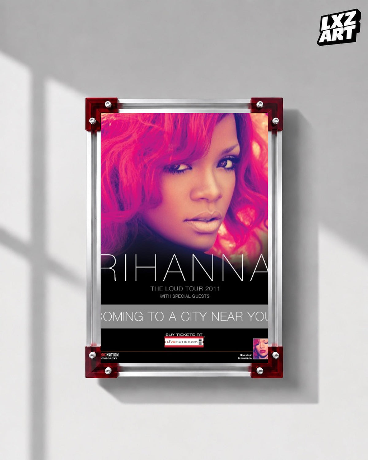 Rihanna Loud Tour 2011 concert poster displayed on a gray wall in a red corner frame; unframed print, frame not included