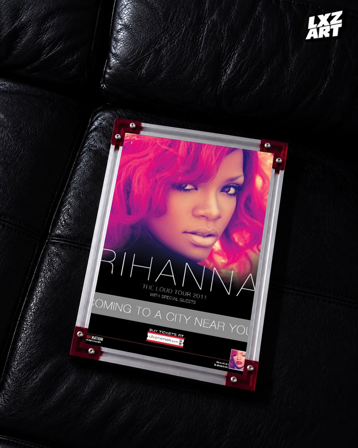 Rihanna Loud Tour 2011 concert poster displayed on a black leather sofa in a red corner frame; unframed print, frame not included