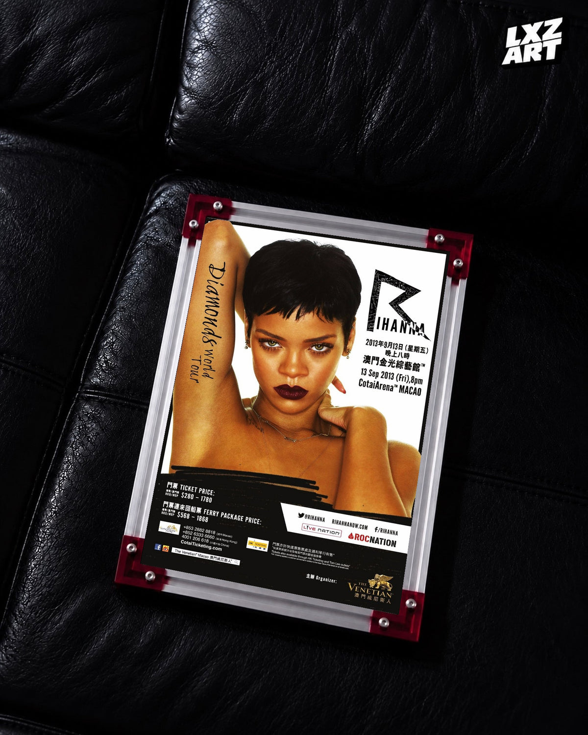 Rihanna Diamonds World Tour Macao concert poster displayed on a black leather sofa in a red corner frame; unframed print, frame not included