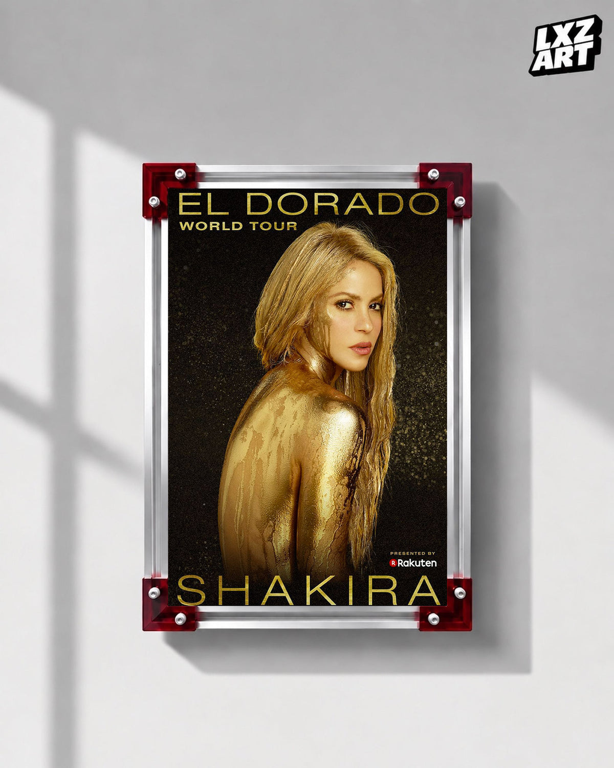 Shakira El Dorado World Tour concert tour poster displayed on a gray wall in a red corner frame; unframed print, frame not included
