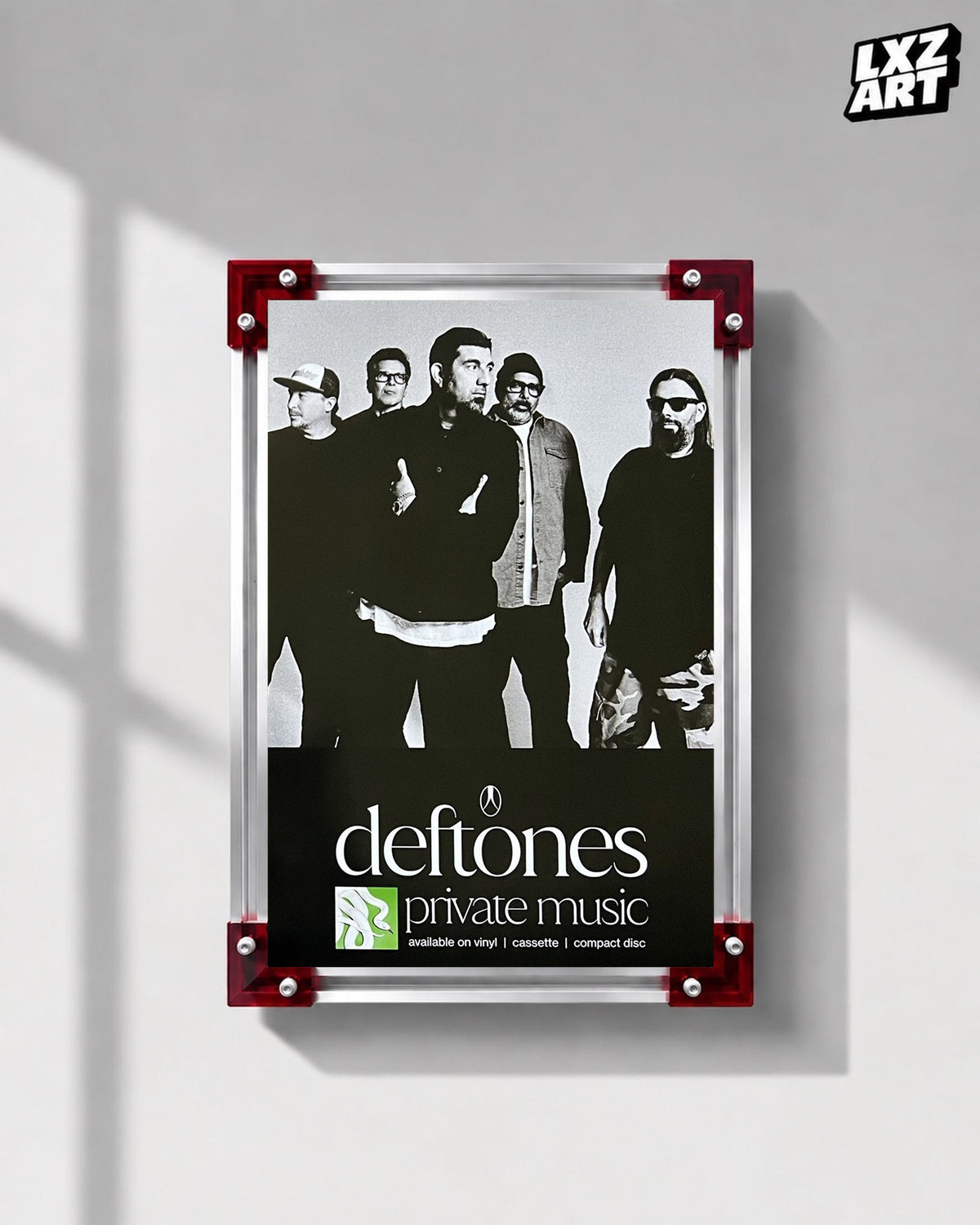 Deftones Private Music Monochrome Band Album Poster displayed on a gray wall in a red-corner frame; unframed print, frame not included