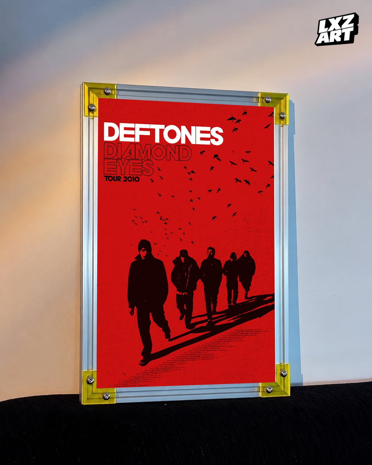 Deftones Diamond Eyes Red Silhouettes 2010 Tour Poster displayed against a warm wall in a yellow-corner frame; unframed print, frame not included