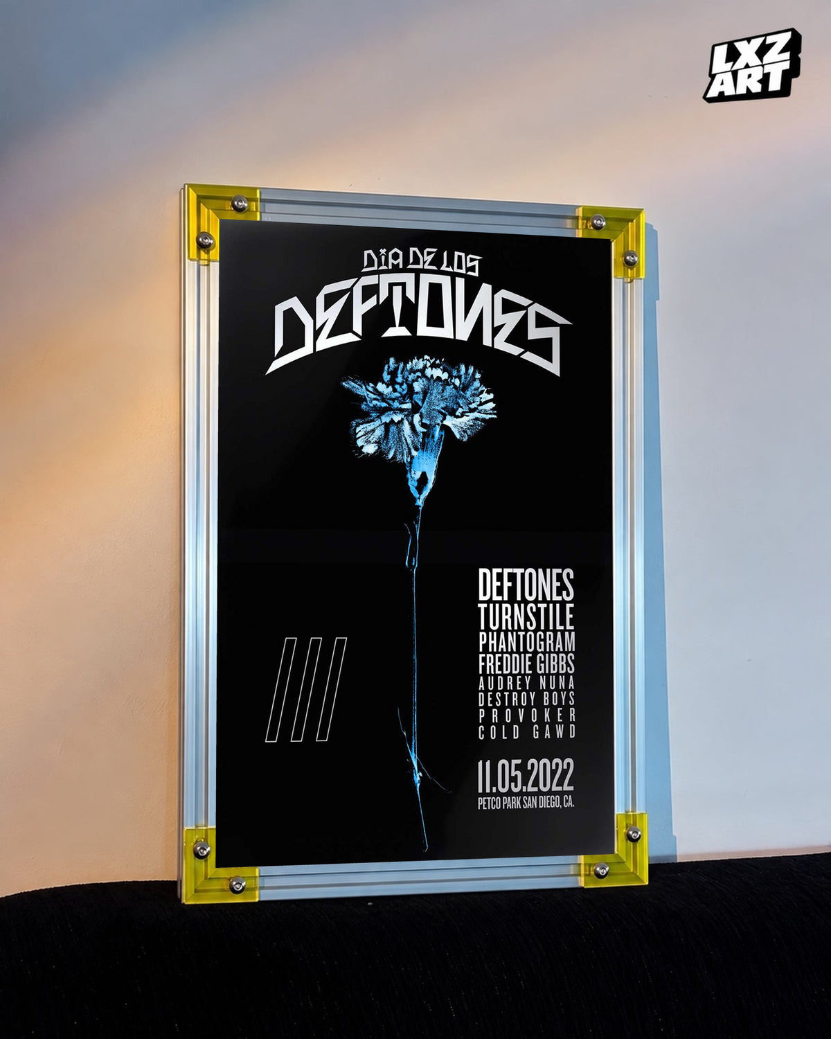 Deftones Dia de los Deftones 2022 Blue Flower Festival Poster displayed against a warm wall in a yellow-corner frame; unframed print, frame not included