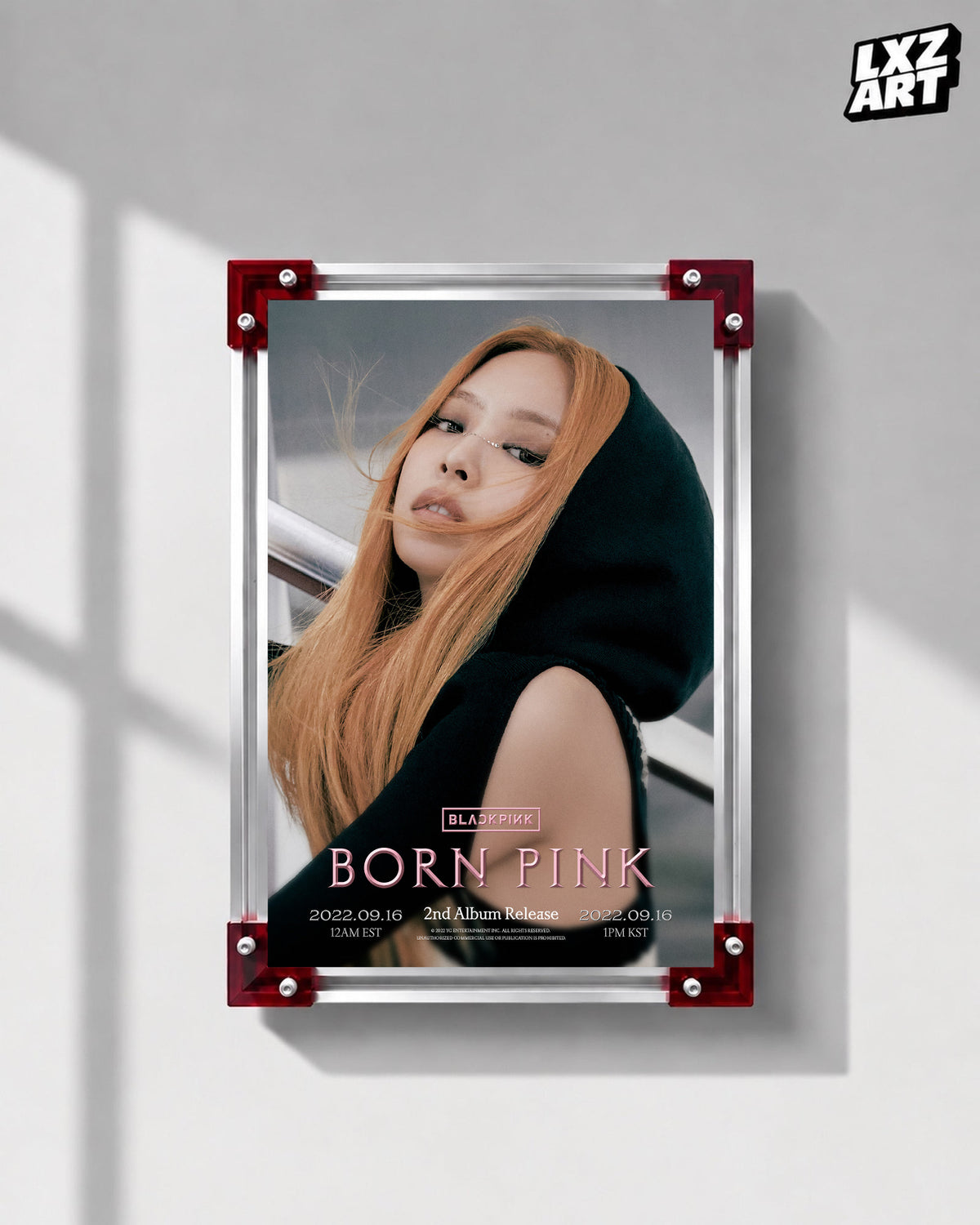 JENNIE BLACKPINK Born Pink hooded concept poster displayed on a gray wall in a red-corner frame; unframed print, frame not included