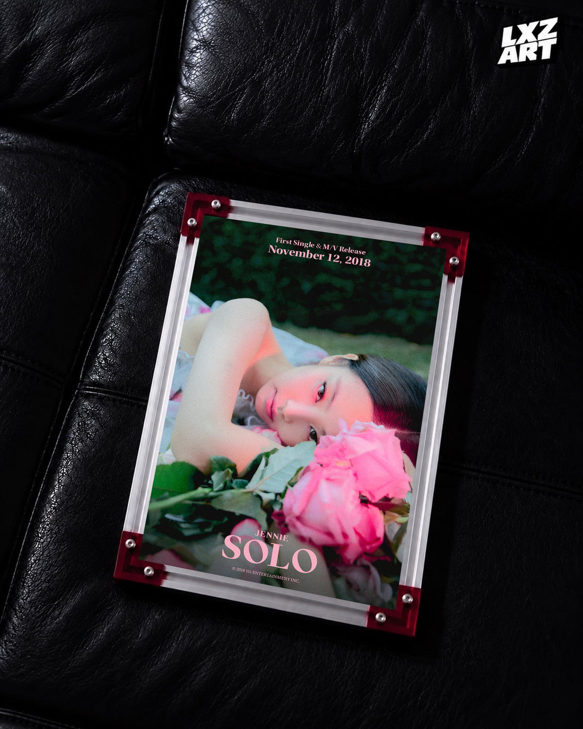 JENNIE SOLO pink rose teaser poster displayed on a black leather sofa in a red-corner frame; unframed print, frame not included
