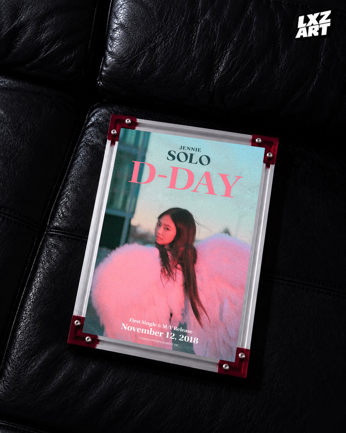 JENNIE SOLO pink d-day poster displayed on a black leather sofa in a red-corner frame; unframed print, frame not included