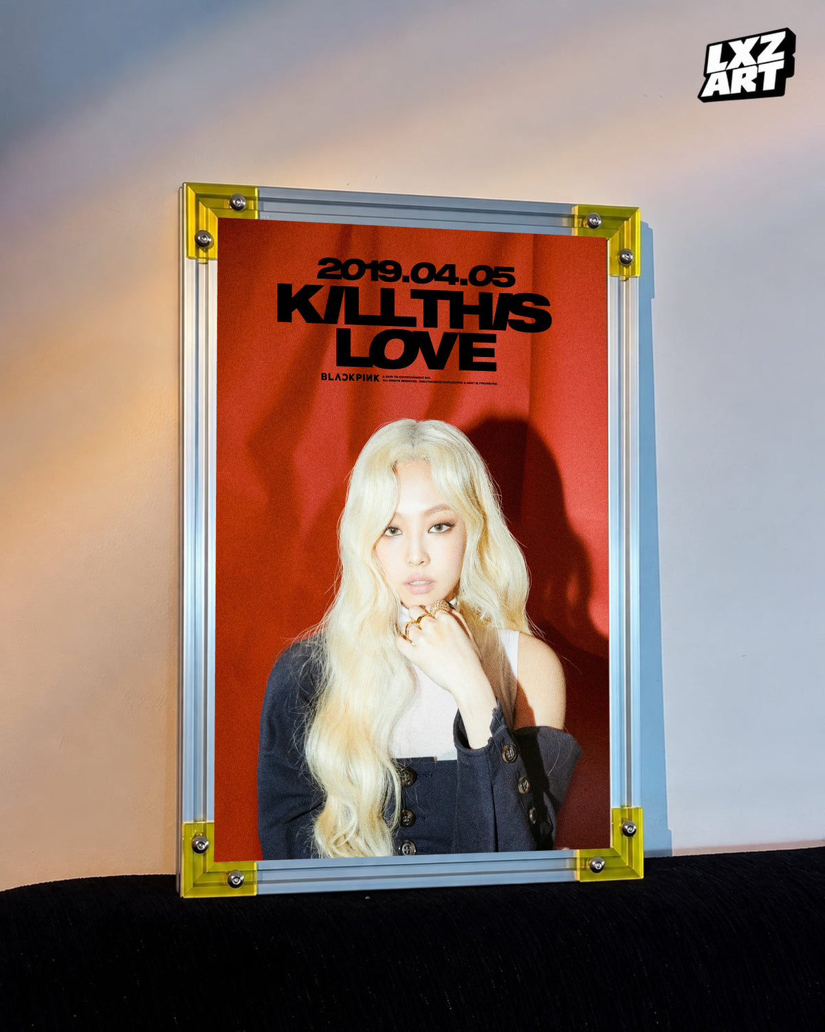 JENNIE BLACKPINK Kill This Love red teaser poster displayed against a warm wall in a yellow-corner frame; unframed print, frame not included