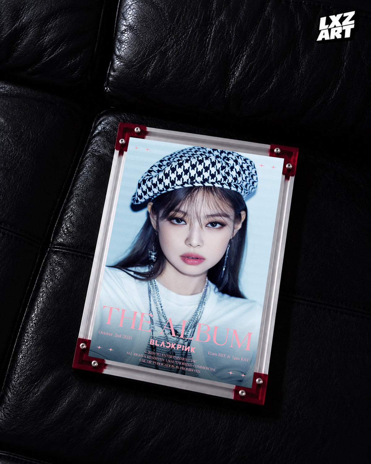 JENNIE BLACKPINK The Album blue beret teaser poster displayed on a black leather sofa in a red-corner frame; unframed print, frame not included