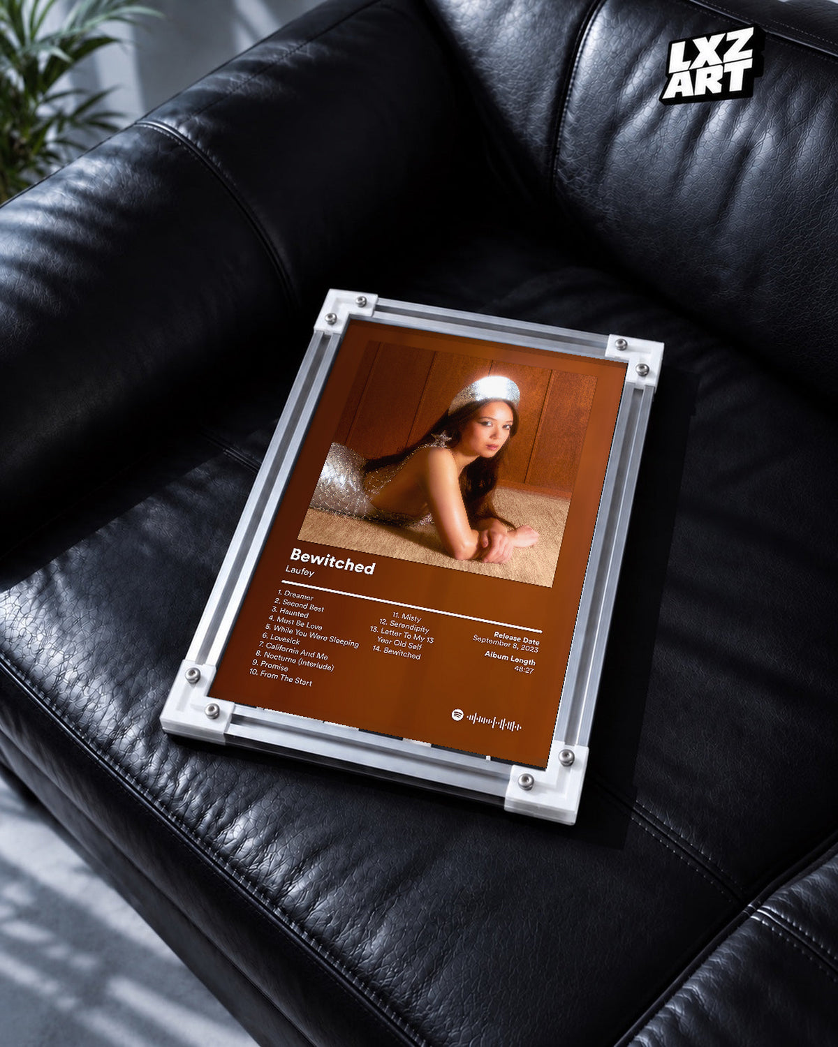 Laufey Bewitched Brown Portrait Tracklist Poster | Unframed Music Wall Art — black leather sofa scene; frame for display only