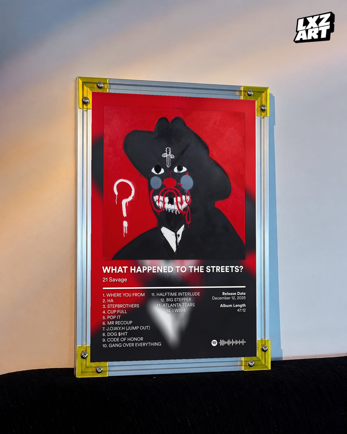 21 Savage What Happened to the Streets? Red Tracklist Poster displayed on a warm wall in a yellow corner frame; unframed print, frame not included