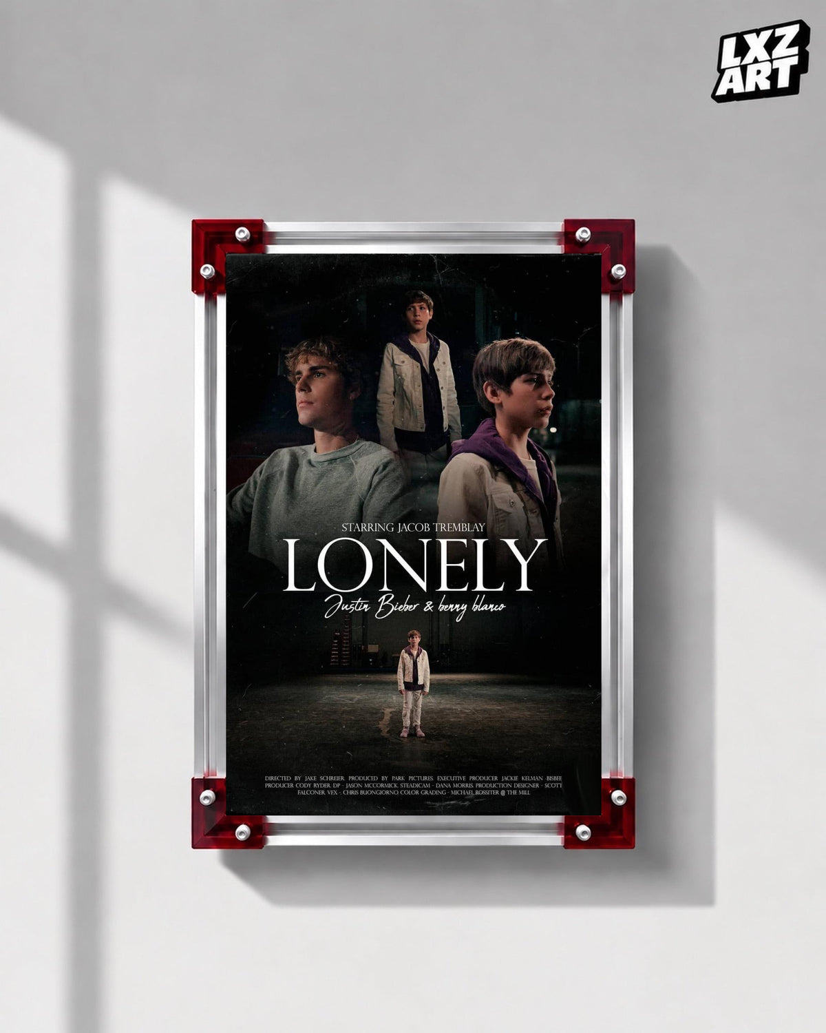 Justin Bieber & benny blanco Lonely Music Video Poster displayed on a gray wall in a red corner frame; unframed print, frame not included