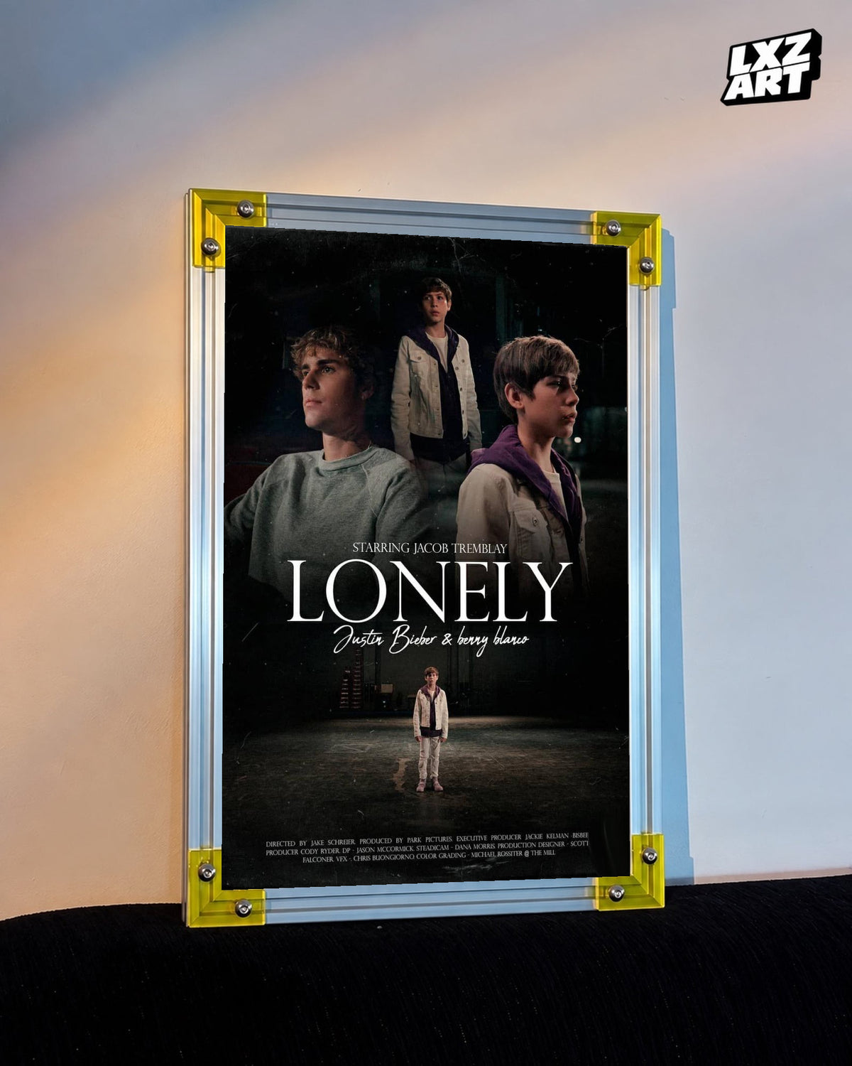 Justin Bieber & benny blanco Lonely Music Video Poster displayed on a warm wall in a yellow corner frame; unframed print, frame not included