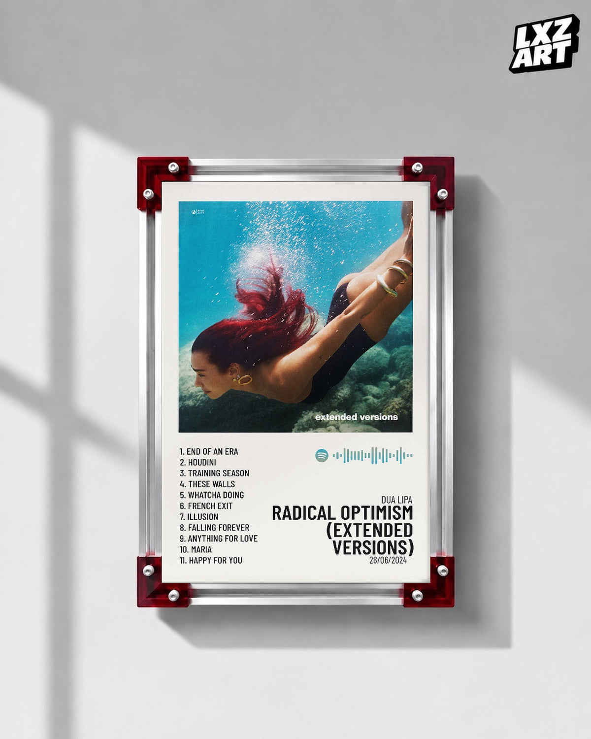 Dua Lipa Radical Optimism Extended Versions Underwater Tracklist Poster displayed on a gray wall in a red corner frame; unframed print, frame not included