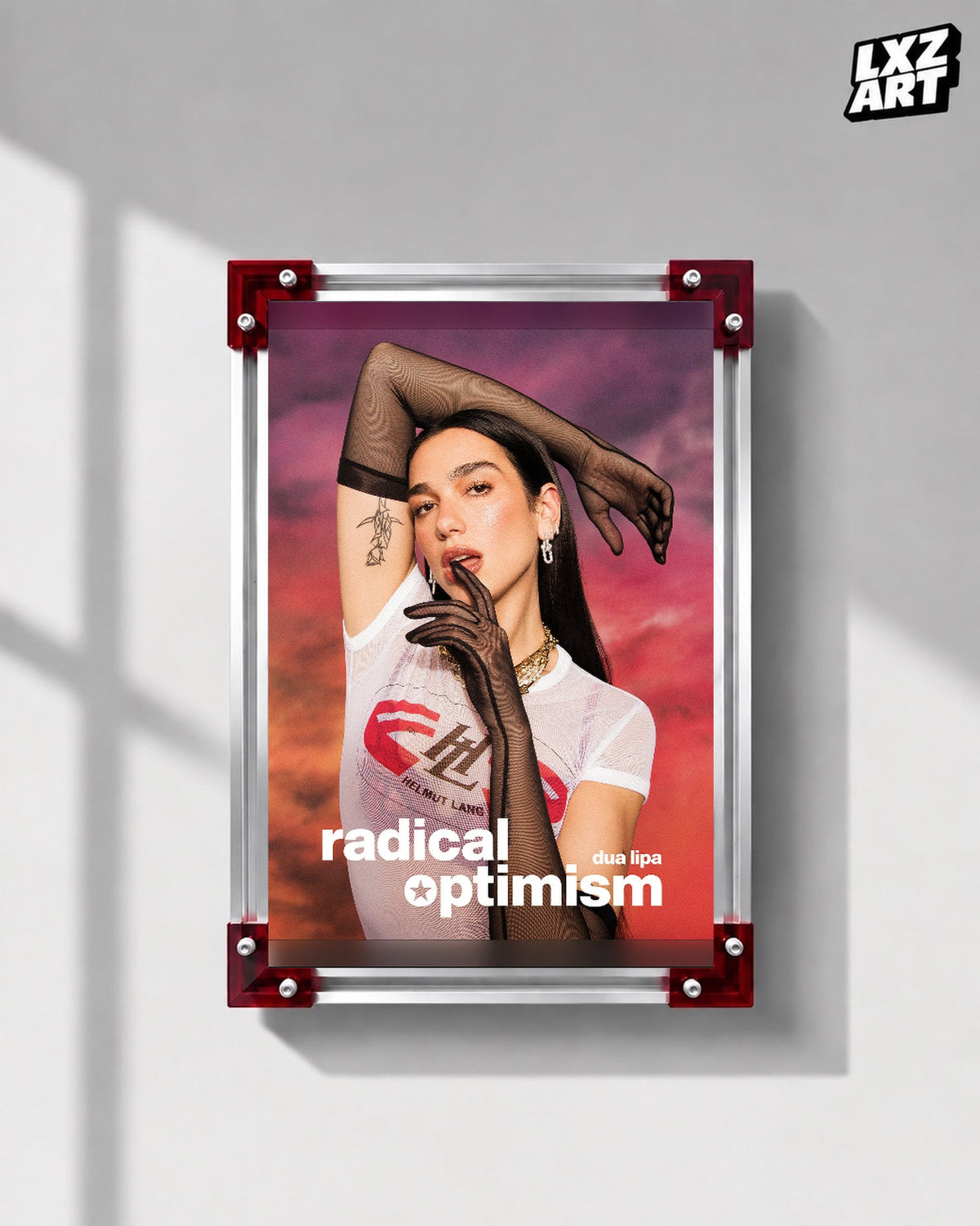 Dua Lipa Radical Optimism Sunset Portrait Poster displayed on a gray wall in a red corner frame; unframed print, frame not included