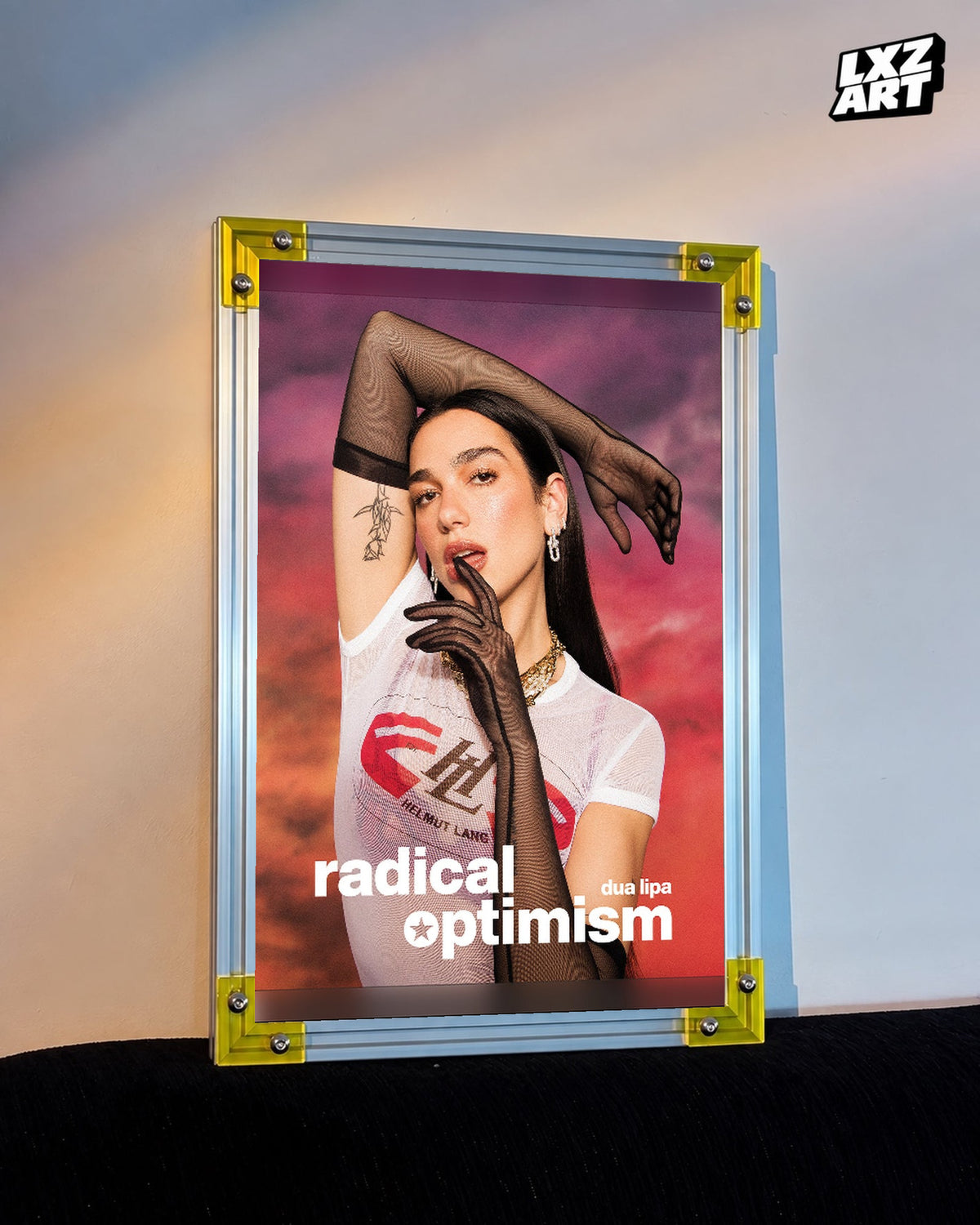 Dua Lipa Radical Optimism Sunset Portrait Poster displayed on a warm wall in a yellow corner frame; unframed print, frame not included