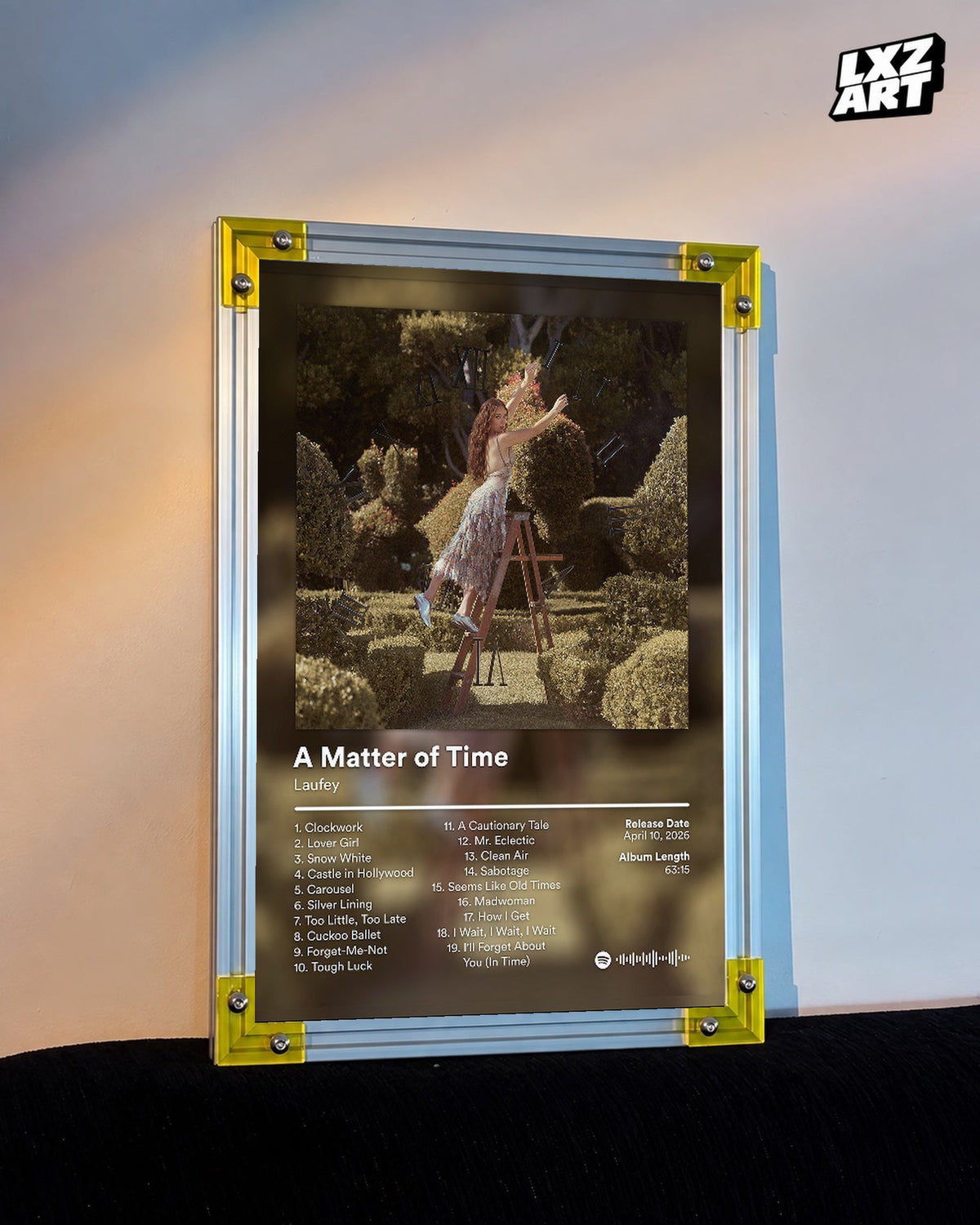 Laufey A Matter of Time The Final Hour Garden Tracklist Poster displayed on a warm wall in a yellow corner frame; unframed print, frame not included