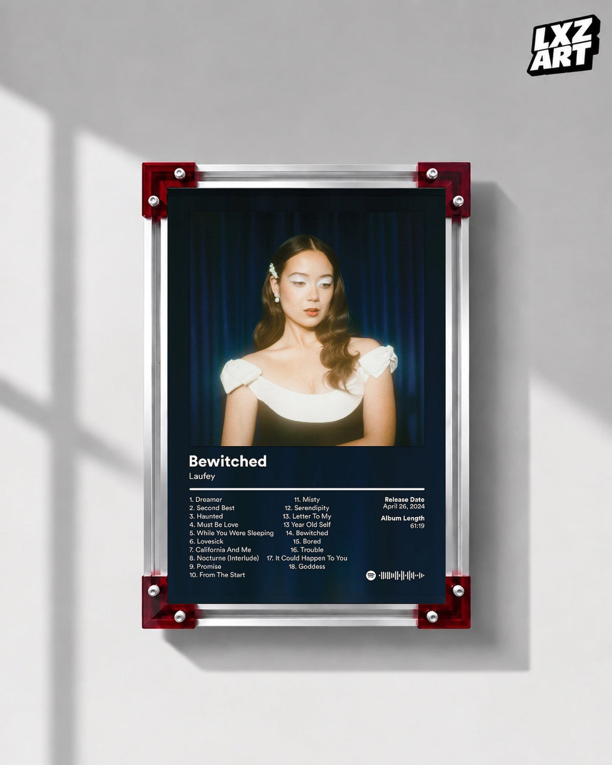 Laufey Bewitched Goddess Edition Blue Curtain Tracklist Poster displayed on a gray wall in a red corner frame; unframed print, frame not included