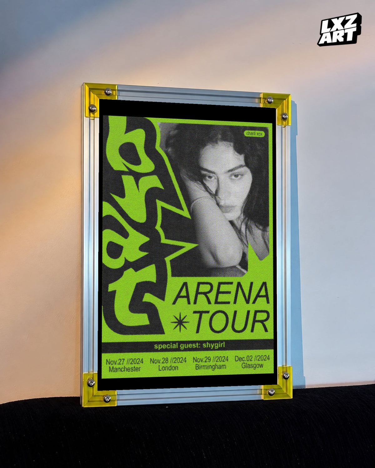 Charli xcx Brat Arena Tour Green Portrait Poster displayed on a warm wall in a yellow corner frame; unframed print, frame not included