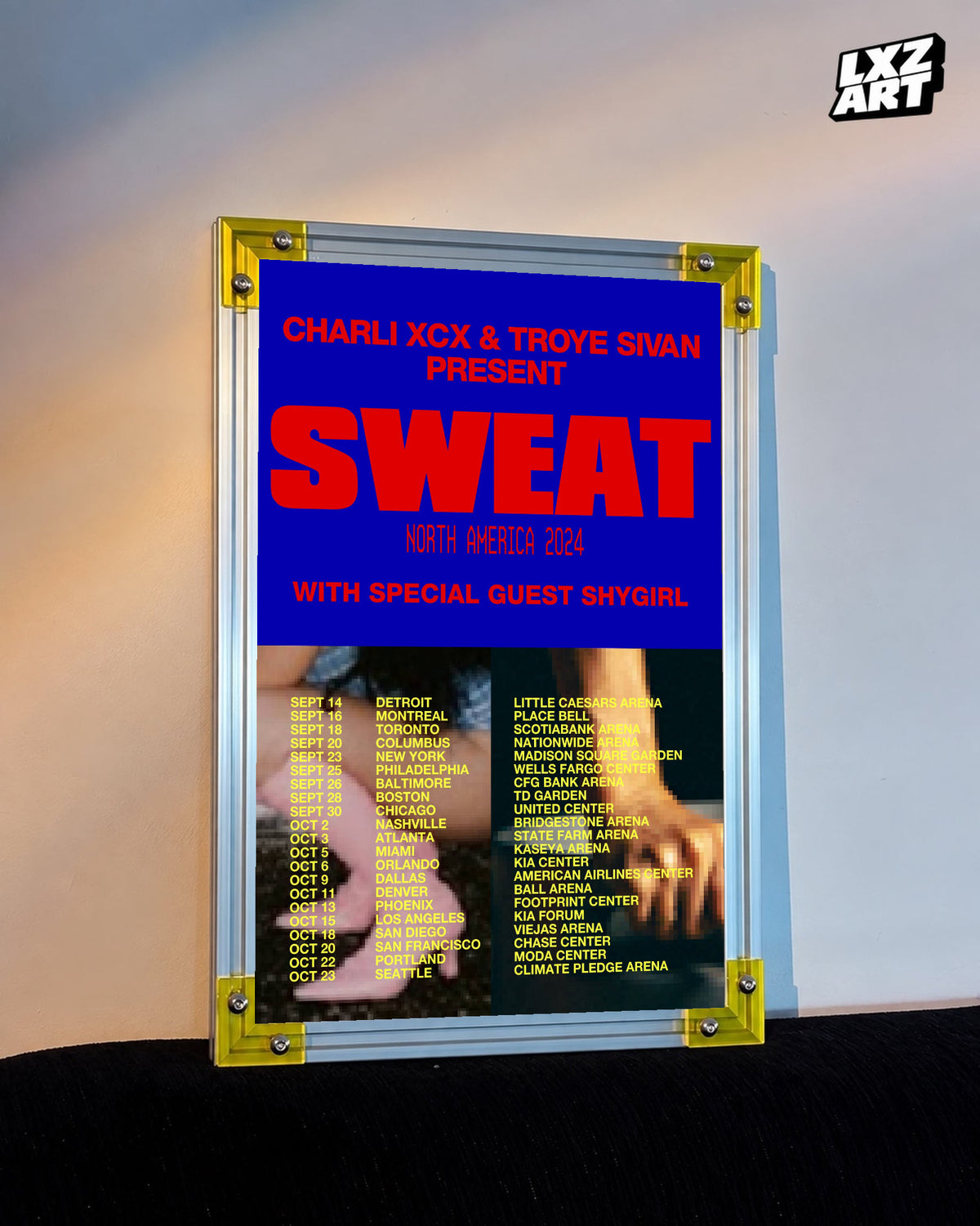Charli xcx Sweat 2024 Blue and Red Tour Poster displayed on a warm wall in a yellow corner frame; unframed print, frame not included