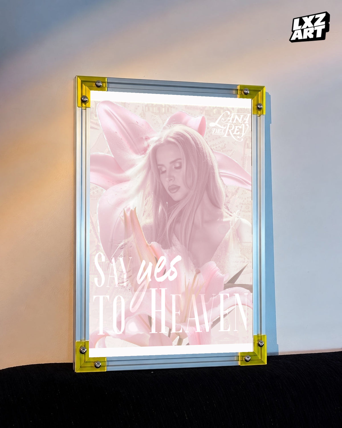Lana Del Rey Say Yes to Heaven Pink Star Portrait Poster displayed on a warm wall in a yellow corner frame; unframed print, frame not included