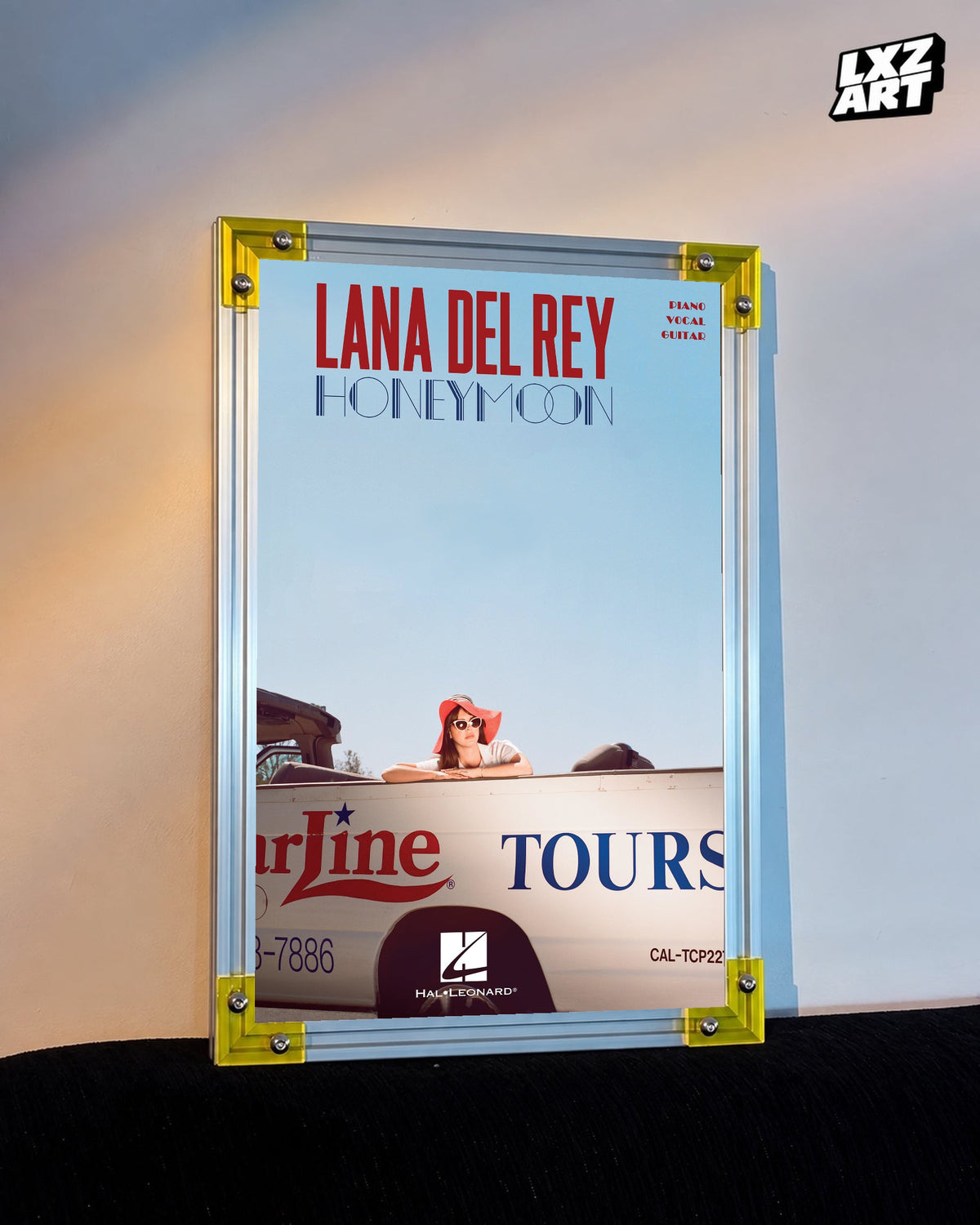 Lana Del Rey Honeymoon Blue Sky Songbook Cover Poster displayed on a warm wall in a yellow corner frame; unframed print, frame not included