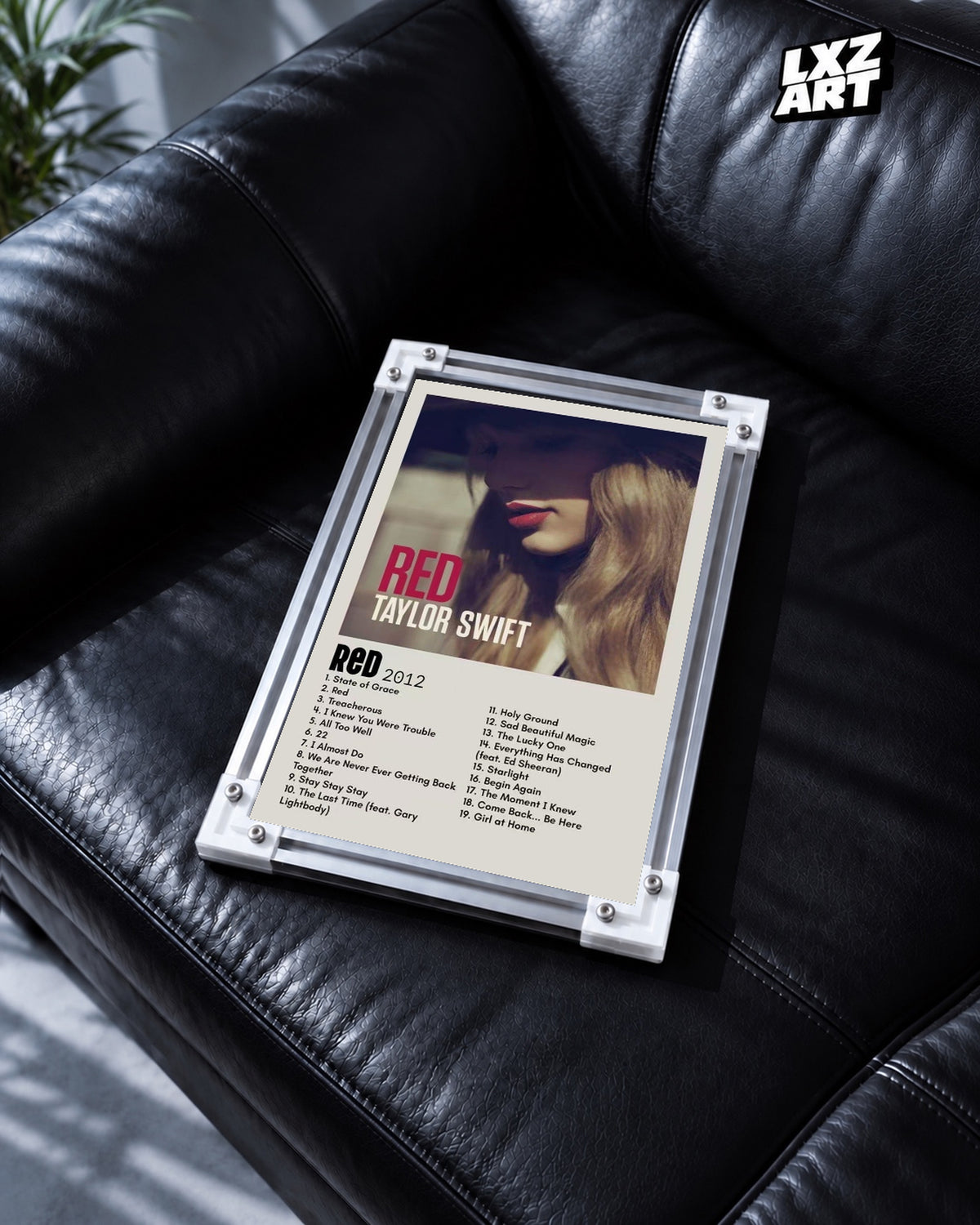 Taylor Swift Red Tracklist Poster — black leather sofa; frame for display only