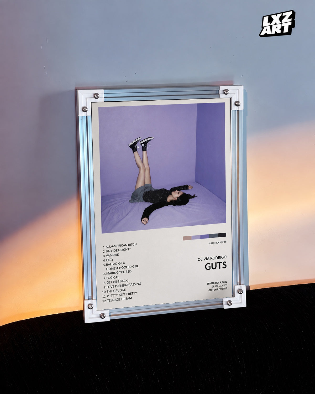 Olivia Rodrigo GUTS Tracklist Poster — warm light wall; frame for display only