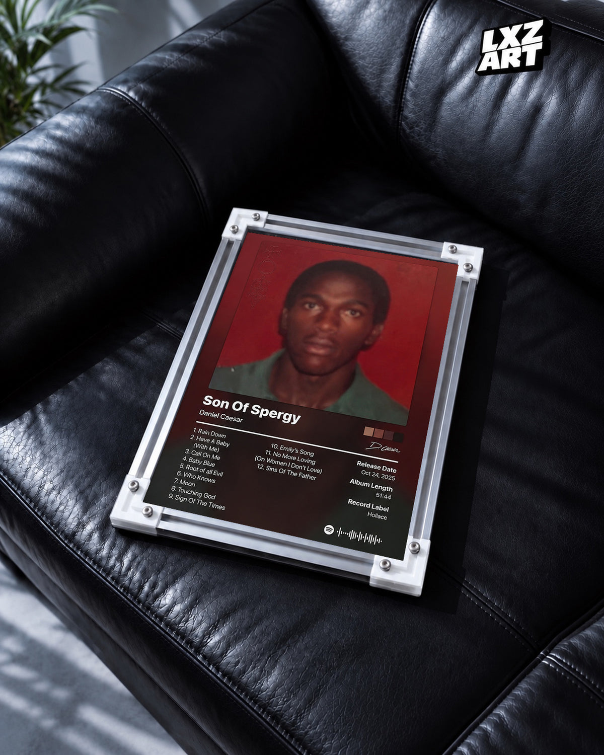 Daniel Caesar Son Of Spergy Tracklist Poster — black leather sofa; frame for display only