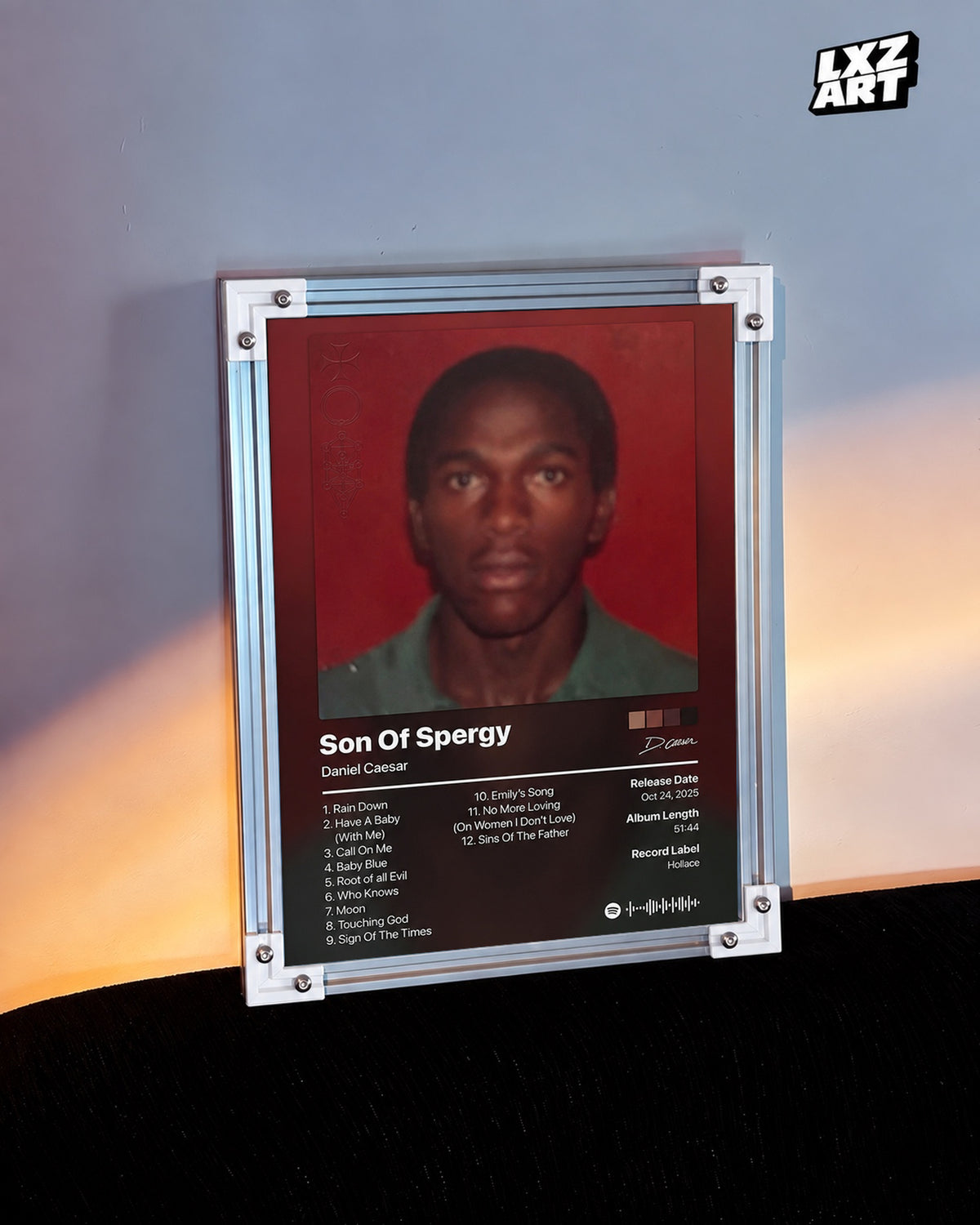 Daniel Caesar Son Of Spergy Tracklist Poster — warm light wall; frame for display only