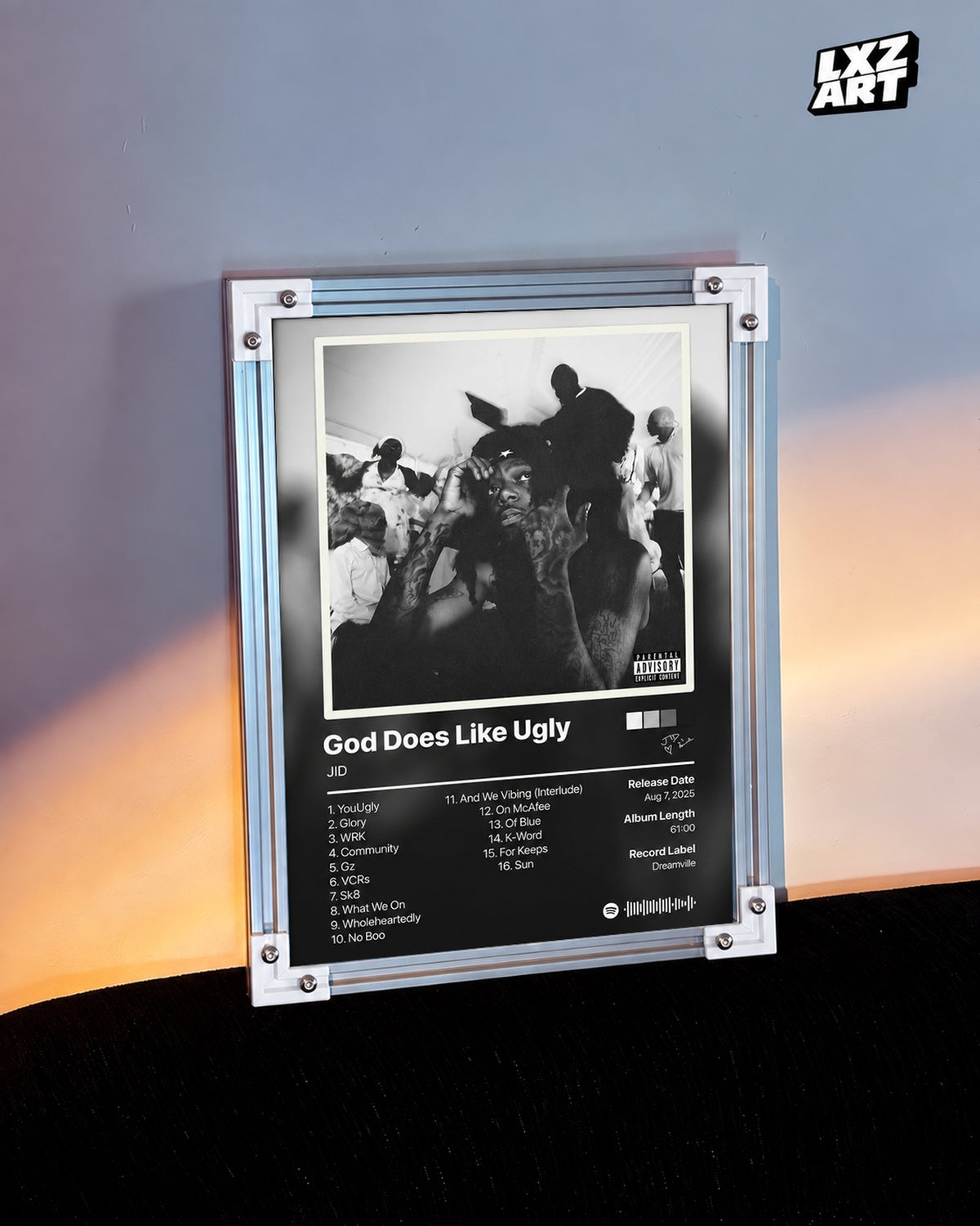 JID God Does Like Ugly Black & White Tracklist Poster — warm light wall; frame for display only