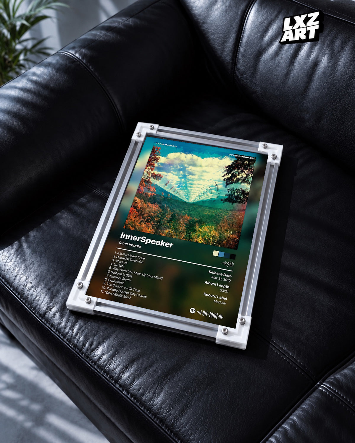 Tame Impala InnerSpeaker Tracklist Poster — black leather sofa; frame for display only